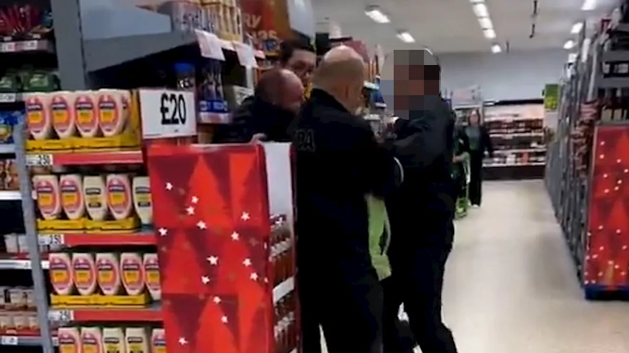 Moment Asda 'security guard punches and slaps customer as he is held down by two workers'