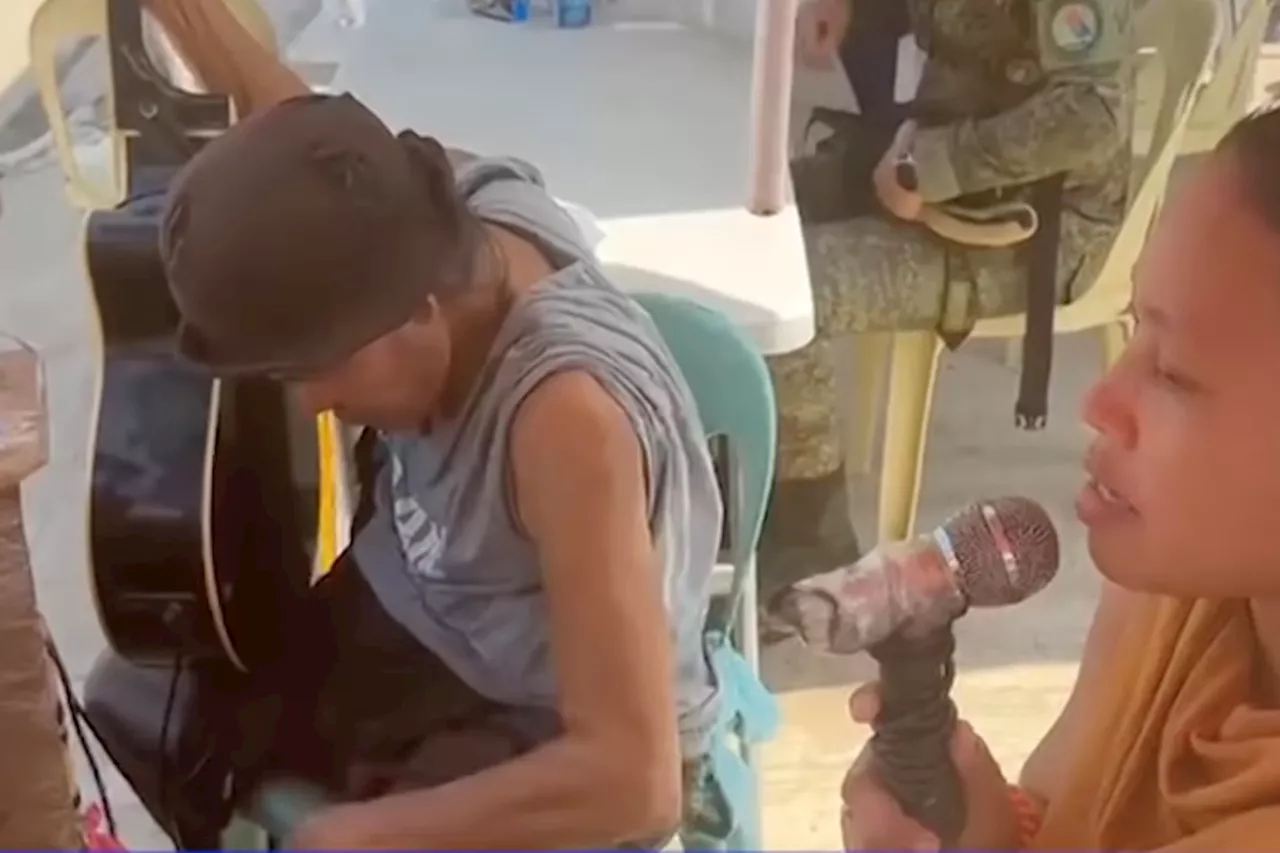 Dad-daughter tandem sings to cemetery-goers in Cebu