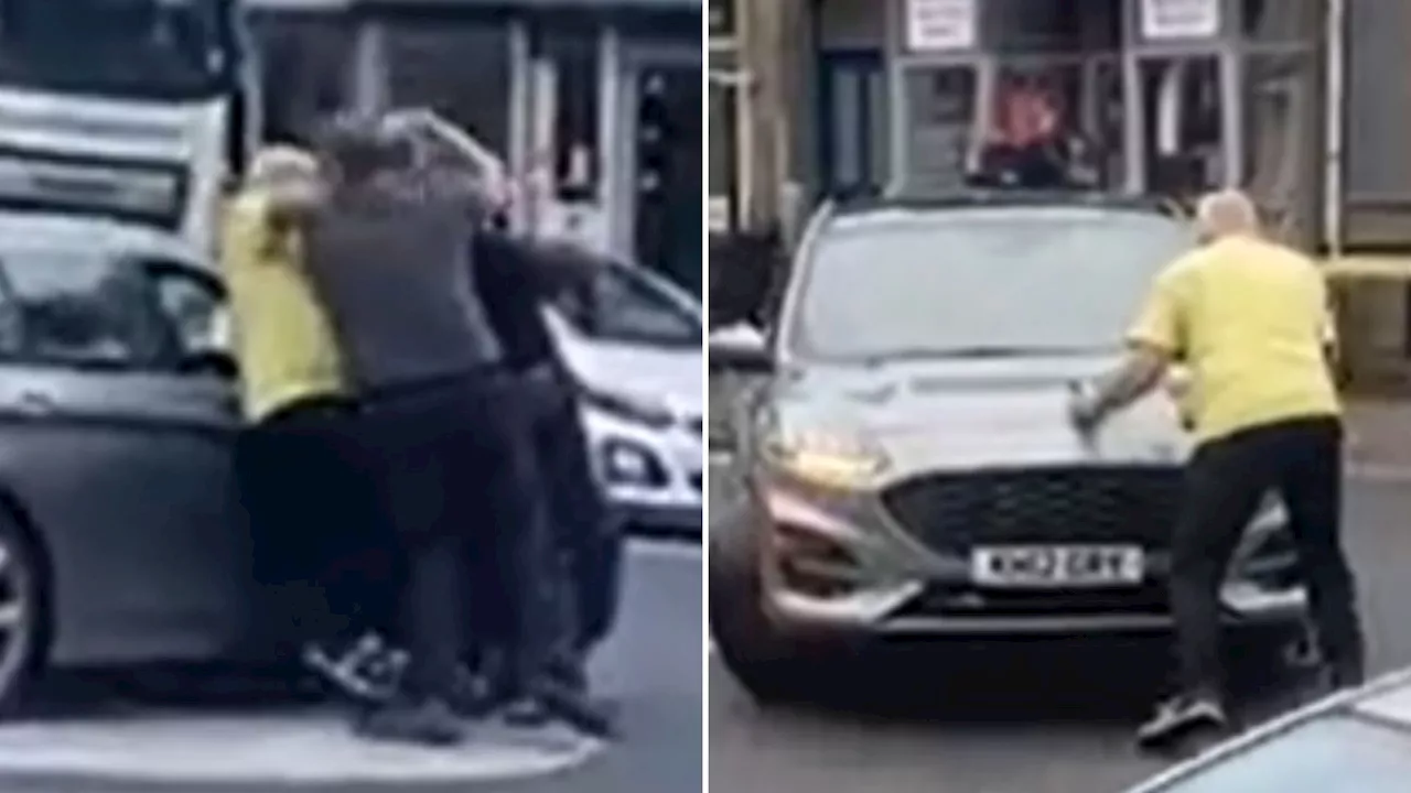 Shocking moment OAP drivers FIGHT in the middle of busy street in road rage brawl