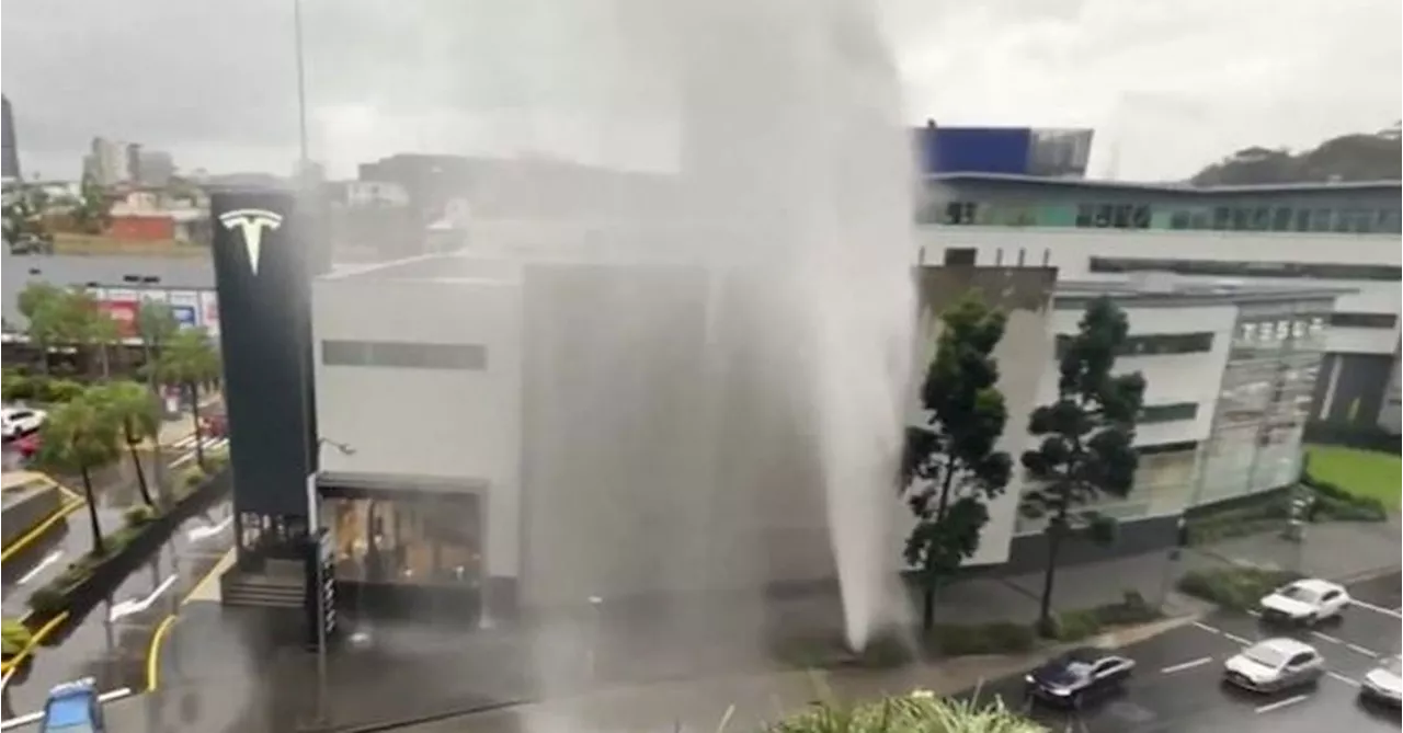 Burst water main sends water sky-high in Brisbane as Queensland cops soaking