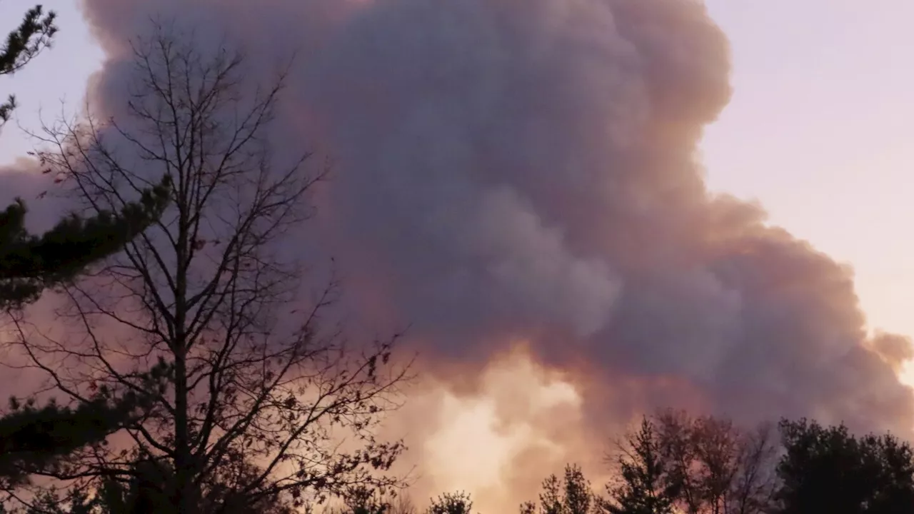 Second teen charged in New Jersey forest fire as rain should help douse New York blaze