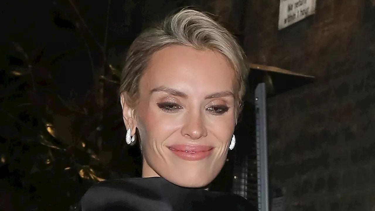 Wallis Day flashes her toned legs in a sexy black bodysuit and silk dress as she joins Lennon...