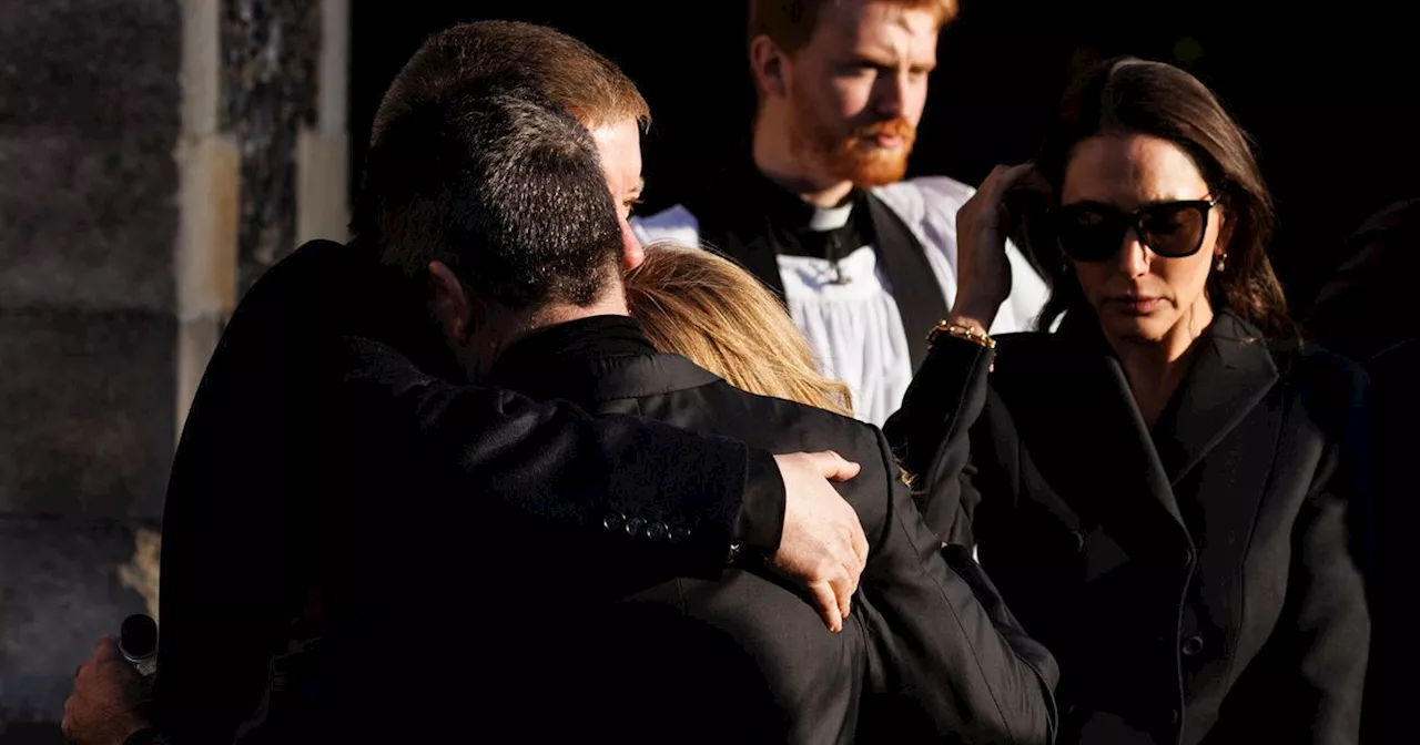 Simon Cowell consoled by Liam Payne's parents as they share hug