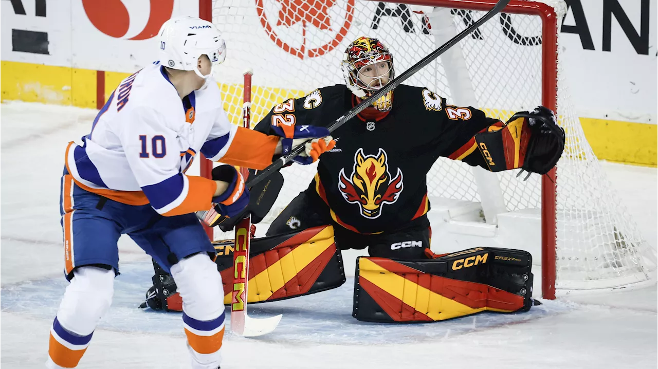 Wolf solid as Flames hang on for shootout win over Islanders