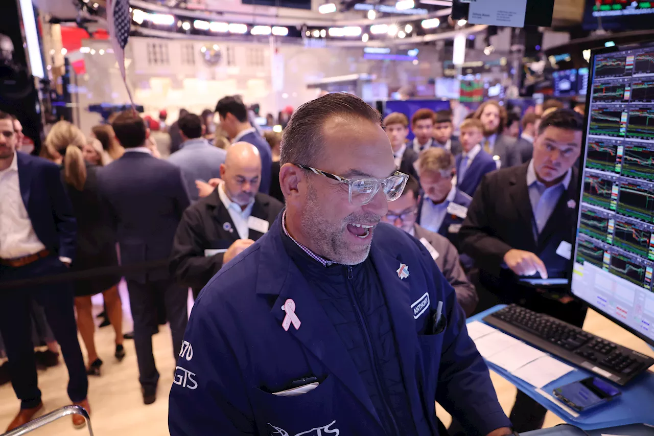 Dow jumps over 600 points, Nasdaq rebounds in volatile Wall Street trading