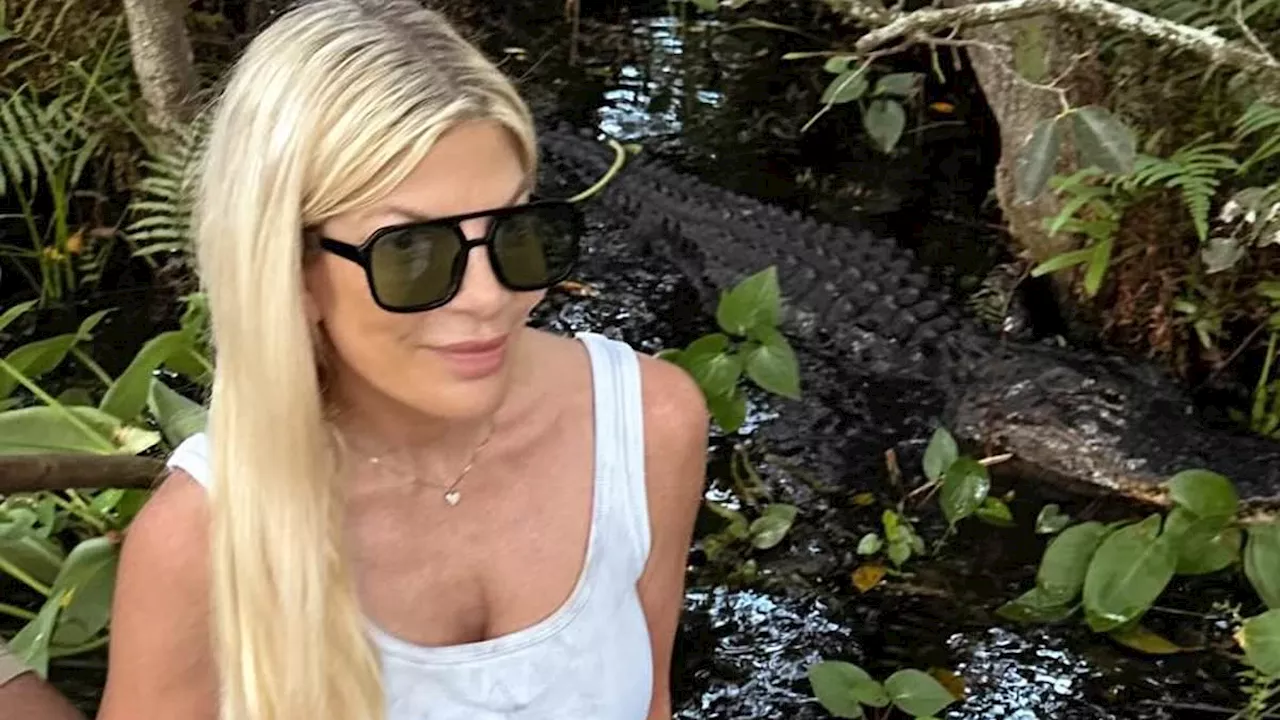 Tori Spelling Gets Up Close and Personal With an Alligator While Filming 'Lost In The Everglades'