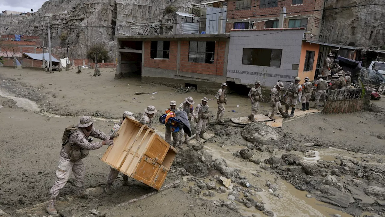 Heavy rains in Bolivia send mud crashing into the capital, leaving 1 missing and destroying homes