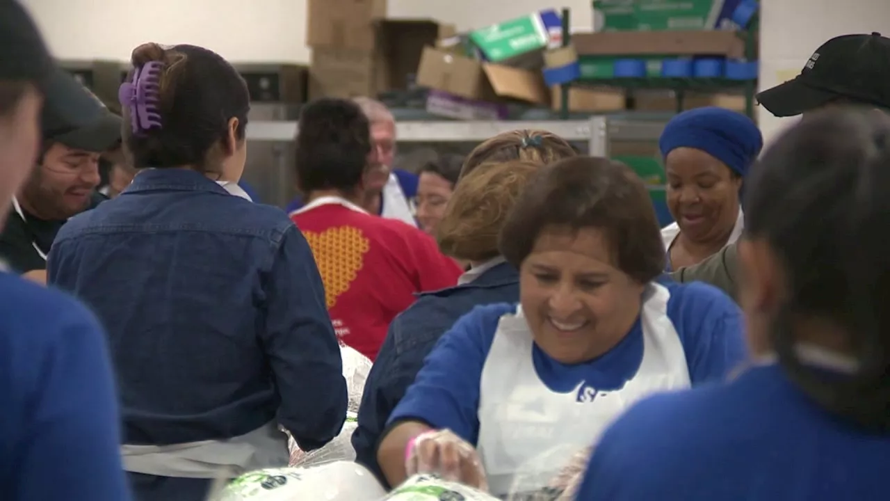 Volunteers for Raul Jimenez Thanksgiving Dinner prepare to feed thousands of people