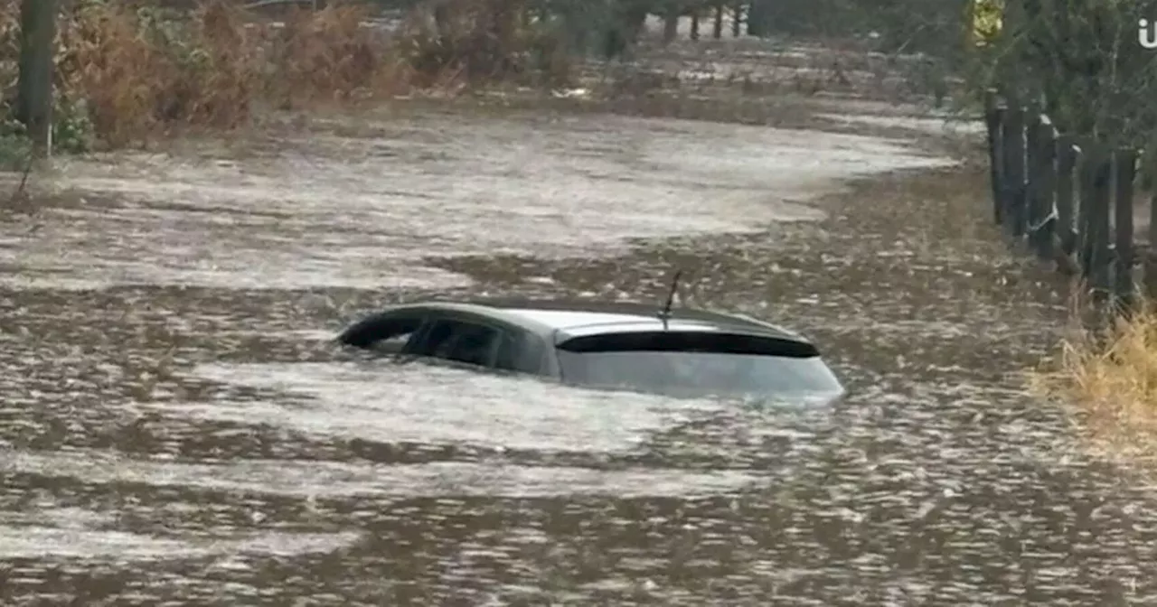 Dad saves 11-month-old baby son as car sinks in 'truly frightening' floodwater