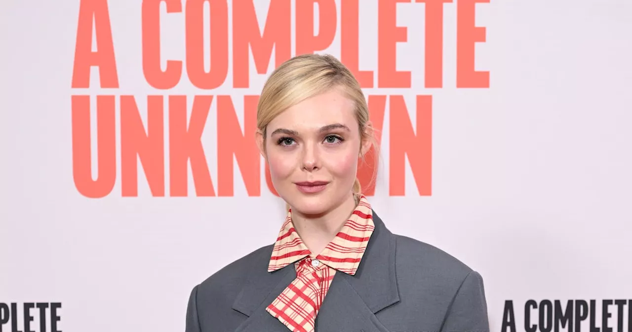 Elle Fanning's Oversized Suit Is A High Fashion Take On The Candy Striper