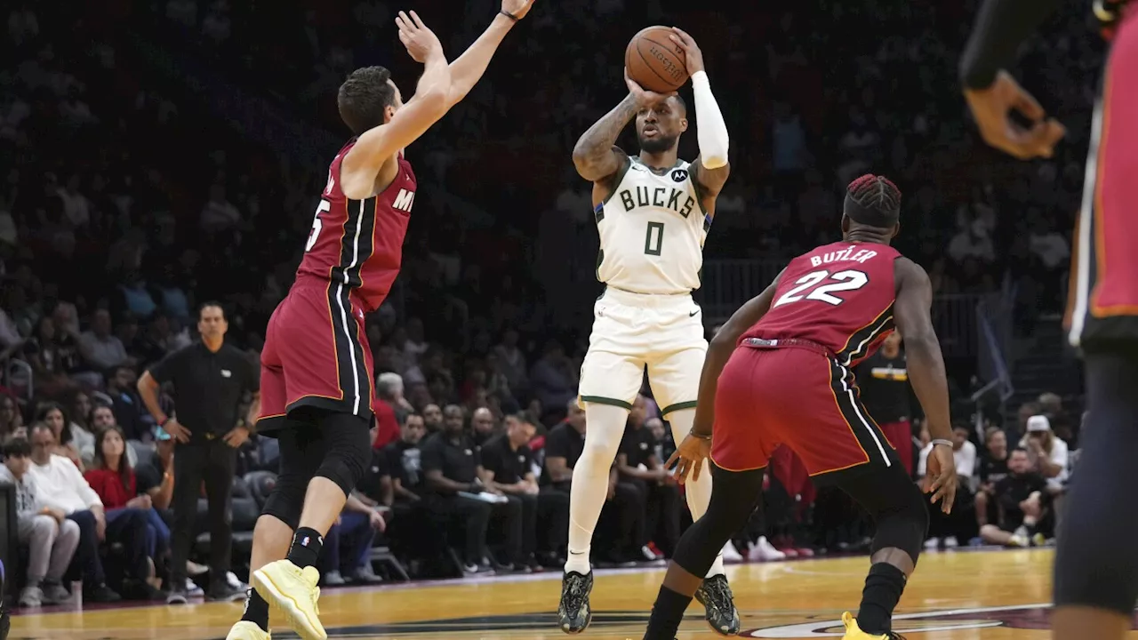 Lillard scores 37 points and Giannis-less Bucks hold off Heat 106-103 to move to 3-0 in Cup play