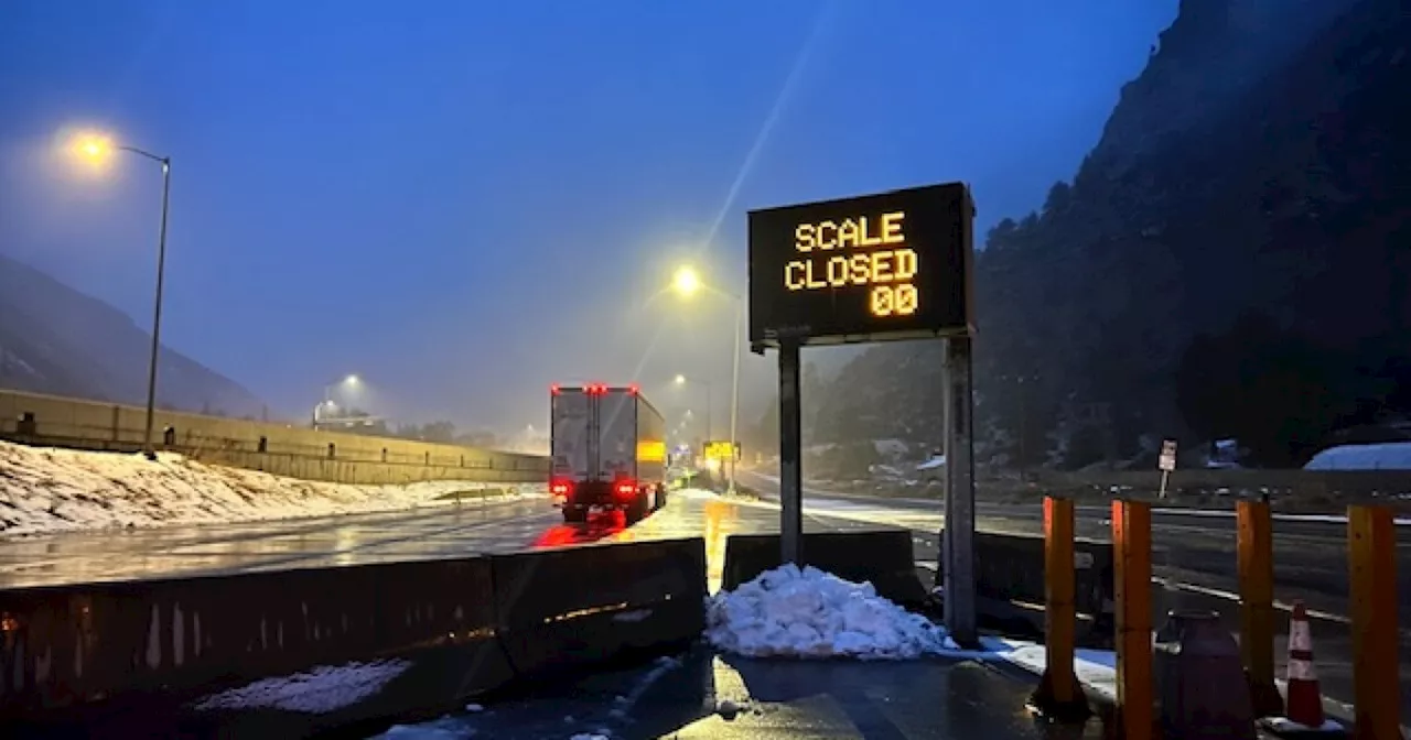 Commercial vehicle drivers heed highway warnings on I-70 through the mountains during snowstorm