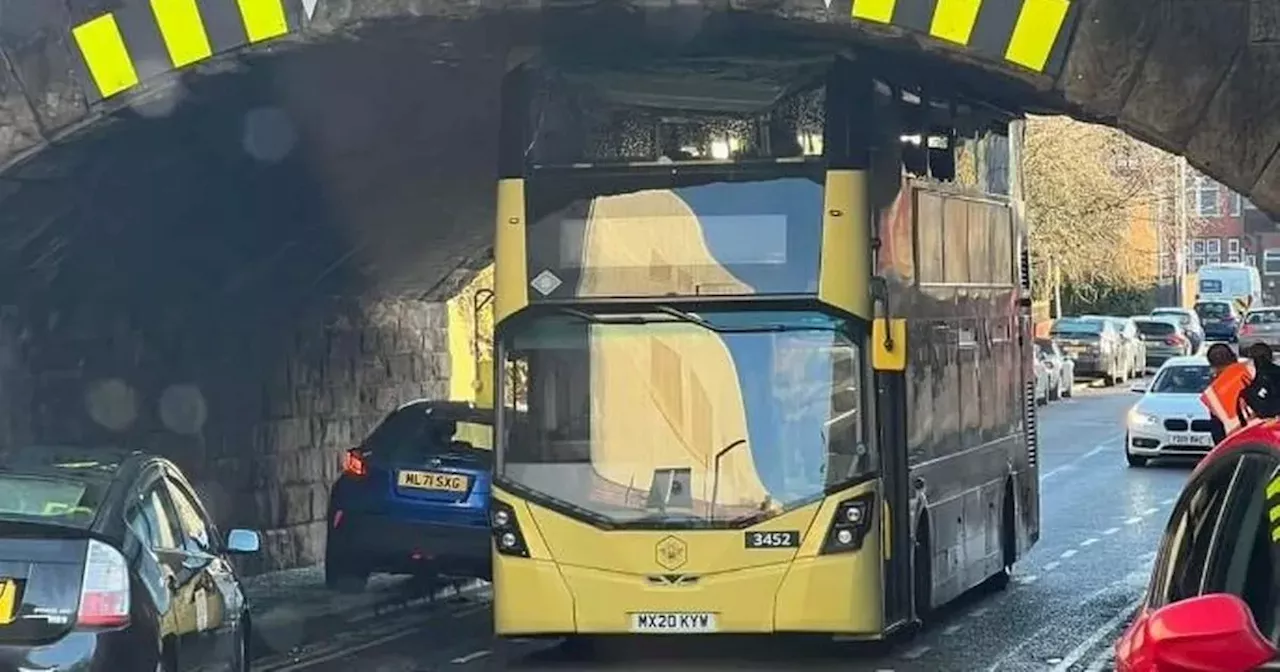 Bus driver 'turned blue' after crashing double decker into low bridge