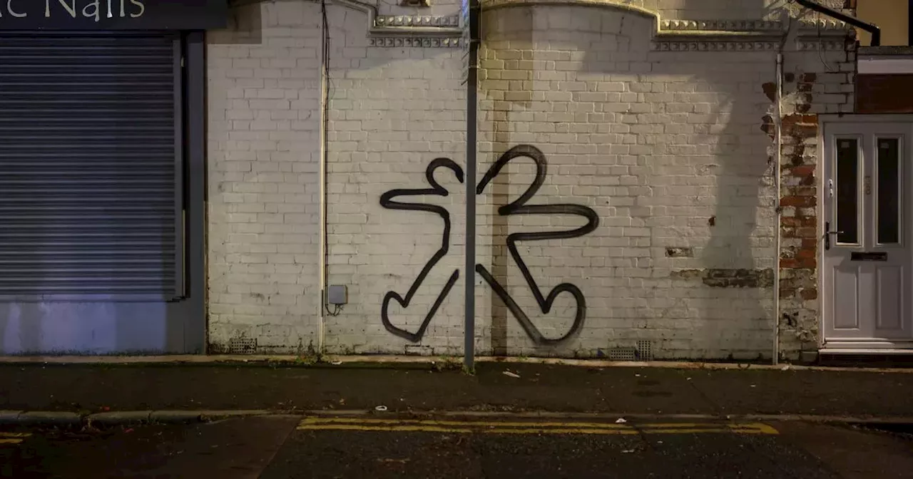 Two-headed man graffiti appears all over city suburb