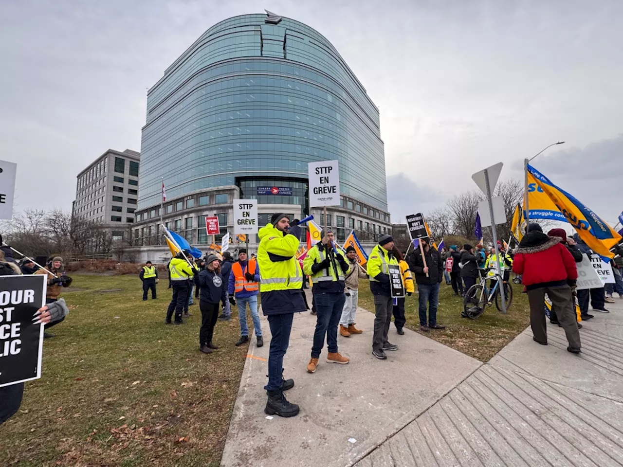 Striking Canada Post workers rally at head office in Ottawa