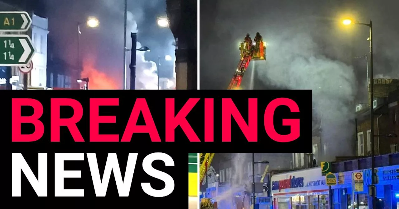 Firefighters rescue residents after huge blaze above restaurant in north London