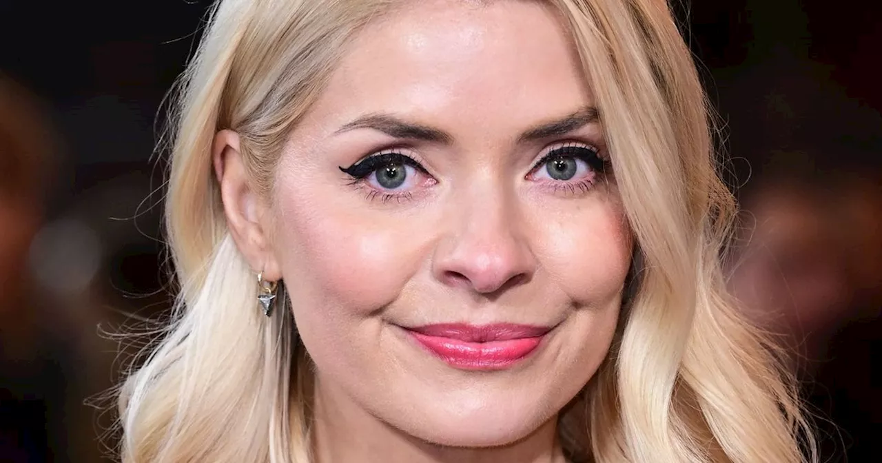 Holly Willoughby wows in plunging dress at Robbie Williams’ biopic premiere