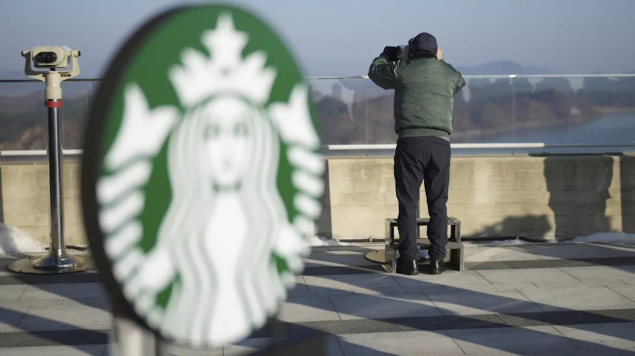 Customers at this Starbucks can sip coffee and observe a quiet North Korean village