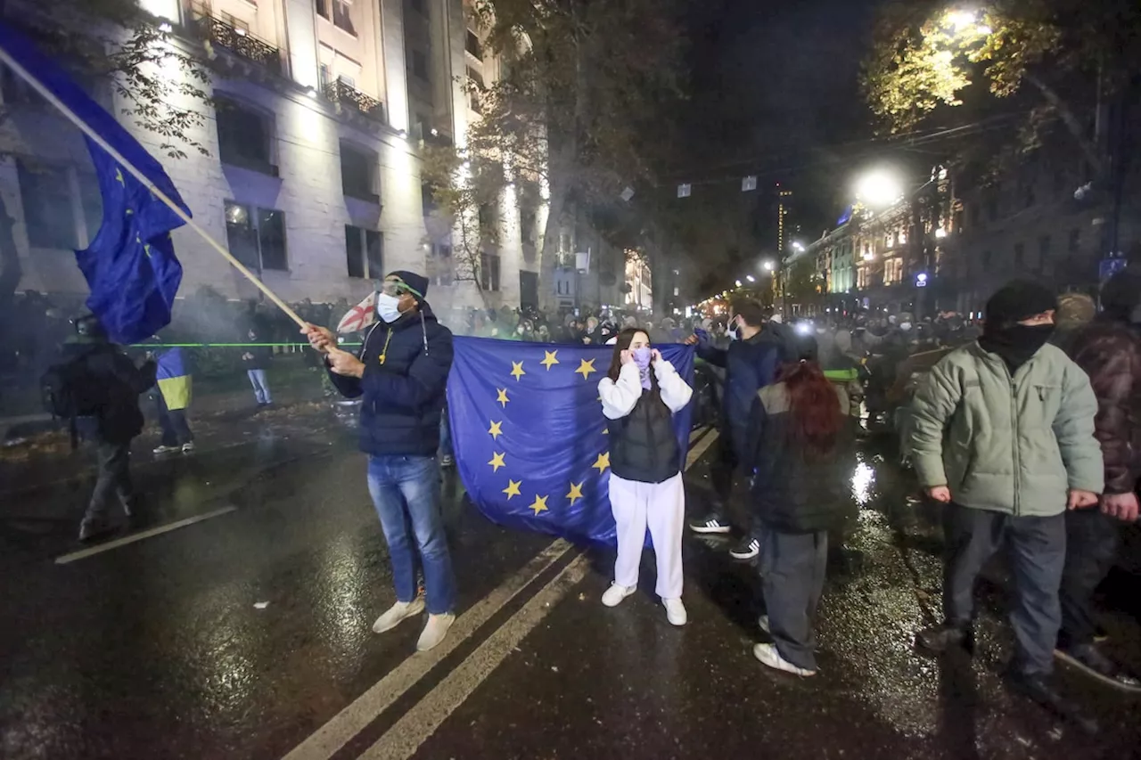 Georgian protesters defy authorities and rally for a second night after EU talks suspended