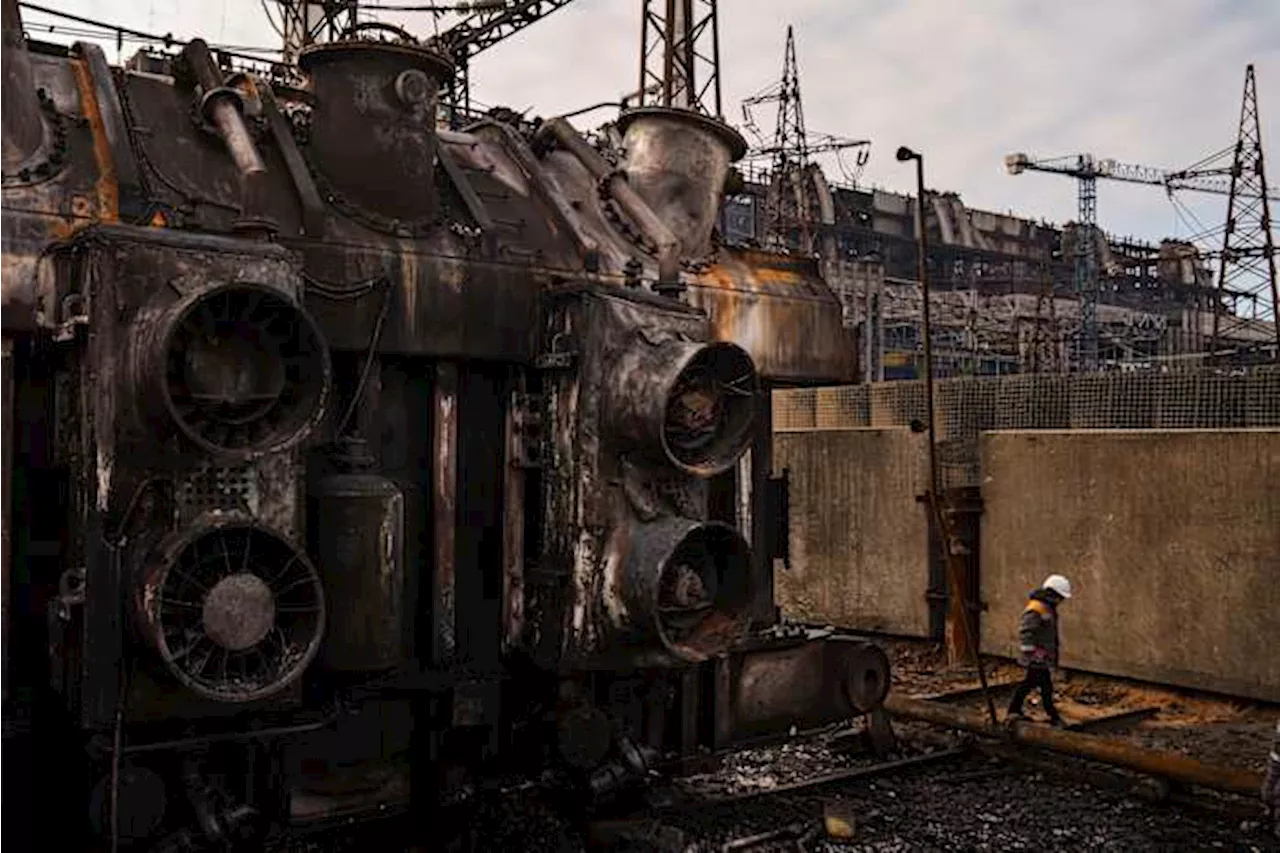 Ukrainian energy workers carry out repairs despite Russia's pounding of the country's power grid