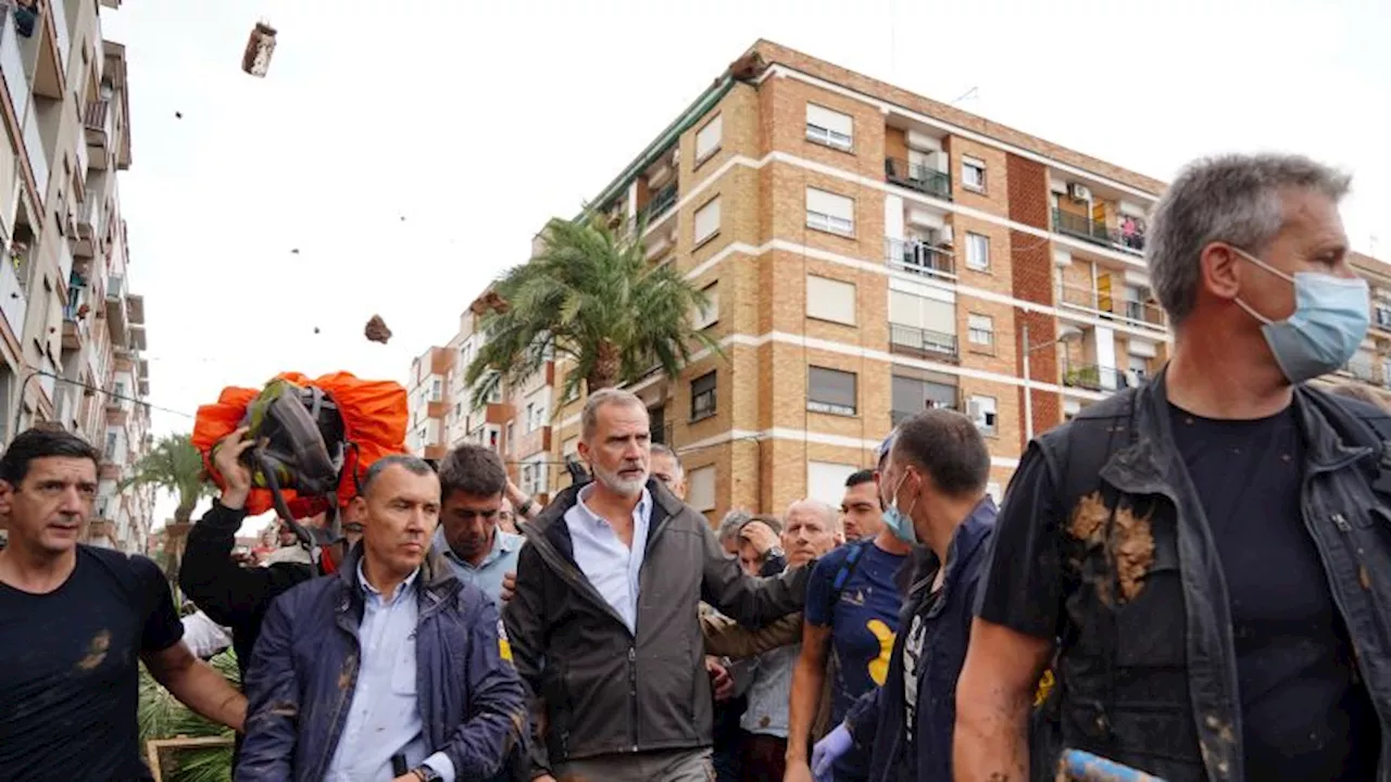 Angry crowds boo and throw eggs at Spanish king as he visits flood-hit Valencia