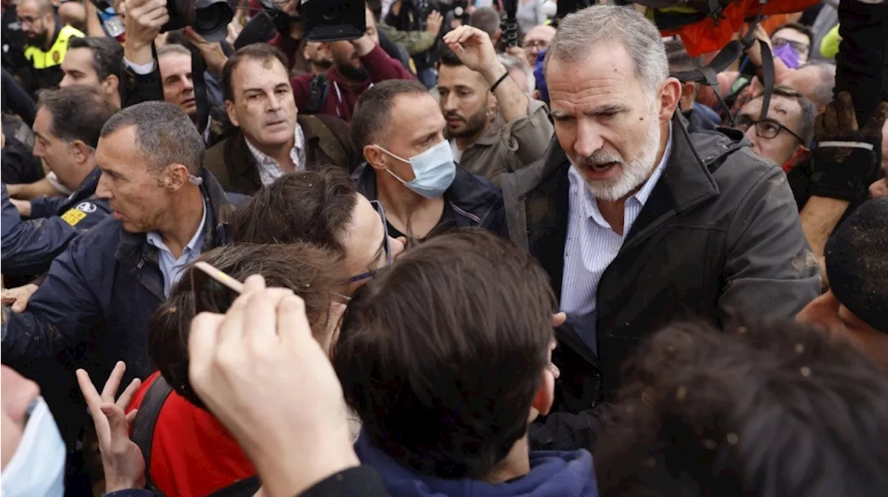 Flood survivors pelt Spain's royals with mud and premier is evacuated during a visit