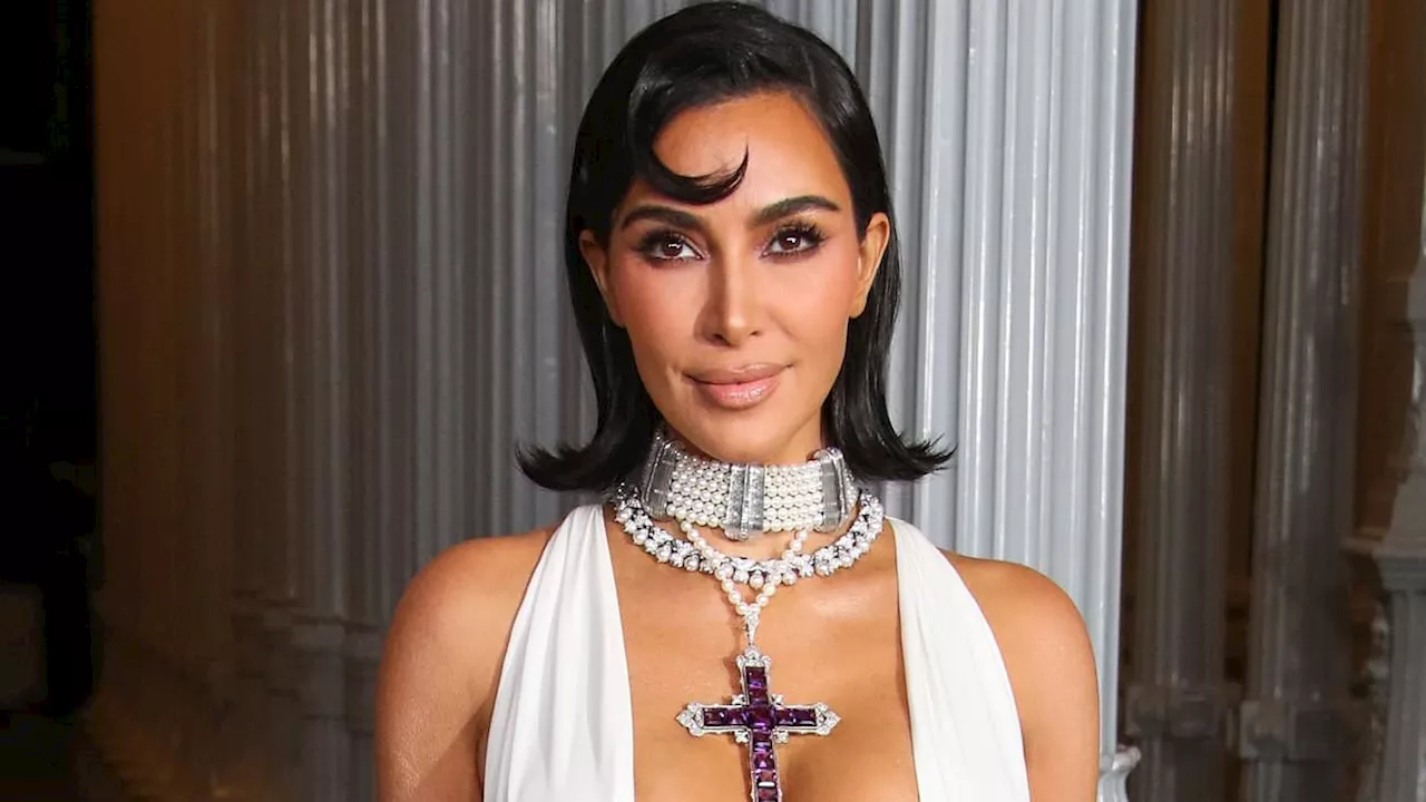 Kim Kardashian accessorizes revealing gown with Princess Diana's amethyst cross at LACMA gala