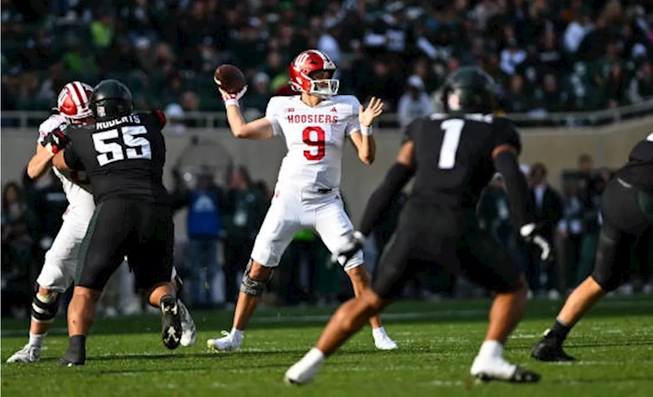 Rourke throws 4 TDs, No. 13 Hoosiers beat Spartans for first 9-0 start in program history