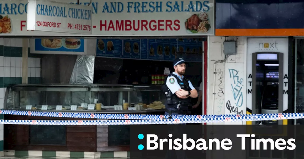 Police examine footage of man on roof after two bodies found in Sydney shop