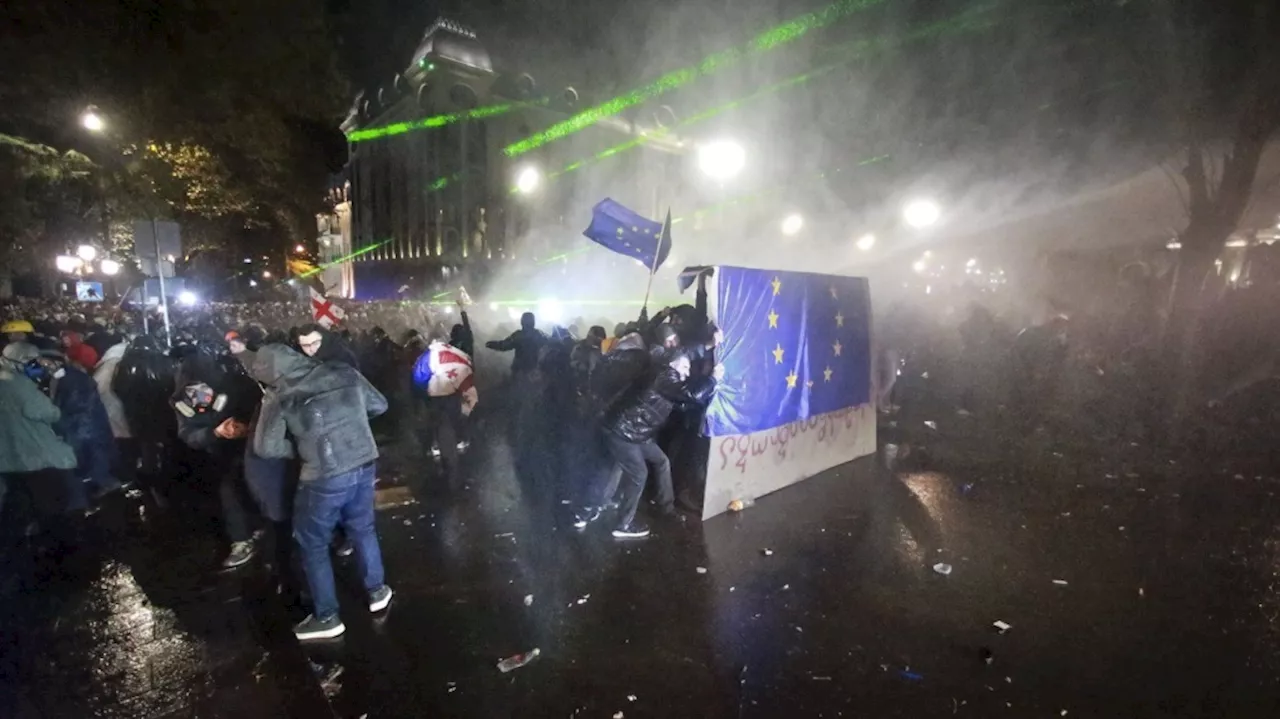 Georgian protesters clash with police for a second night after EU talks are suspended