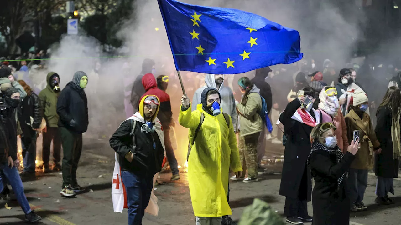 Protesters gather for third night of demonstrations over move to halt EU talks