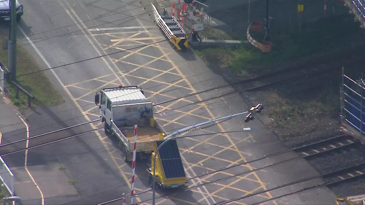 Brisbane trains suspended after truck towing trailer hits powerlines