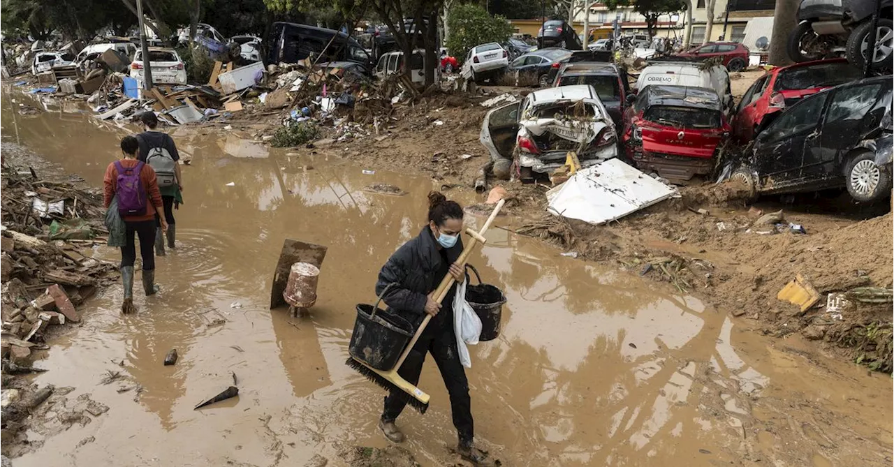 Heavy rains in Barcelona disrupt rail service as troops search for more flood victims in Valencia