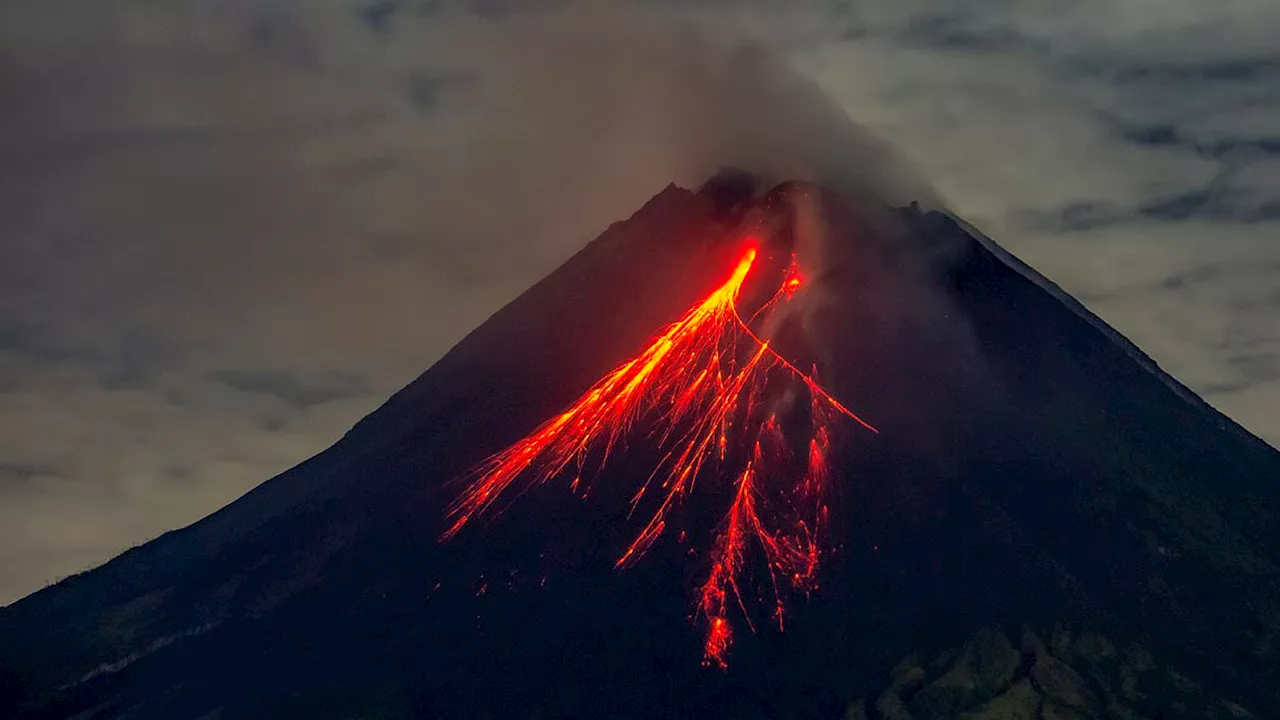 Volcanic eruption kills at least ten as fireballs crash down on villagers in Indonesia