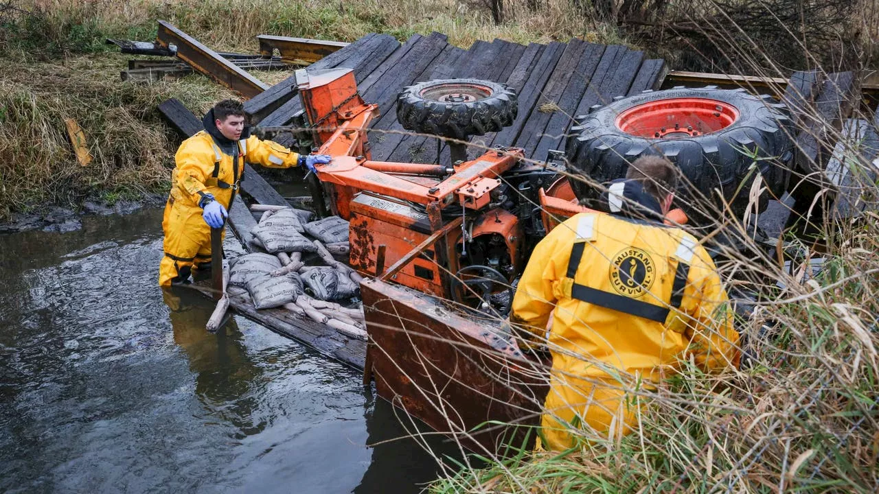 Man in serious condition after being trapped under tractor in Woodstock creek: officials