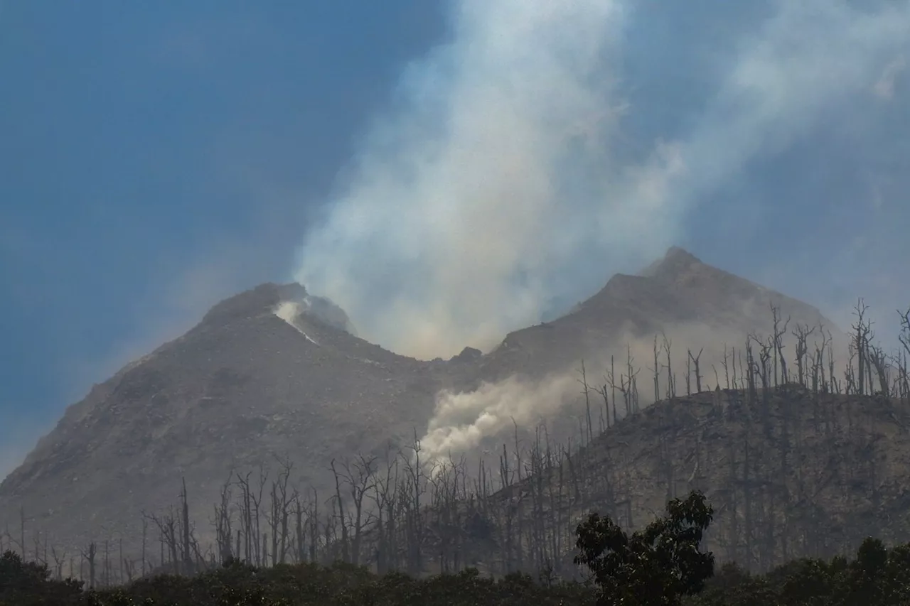 Indonesia volcano eruption kills 10, sets houses aflame