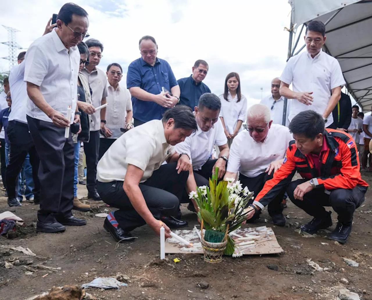 Marcos leads Day of Mourning; distributes aid to typhoon victims