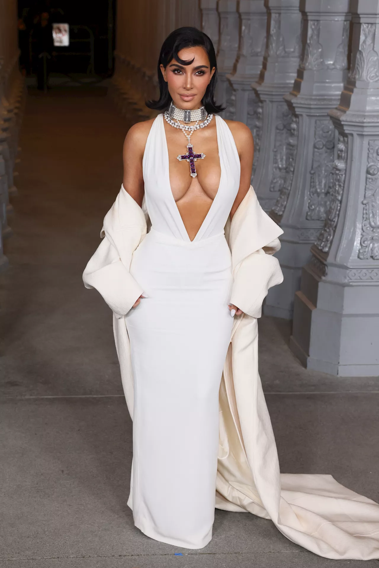 Kim Kardashian wears Princess Diana's cross pendant with royally risqué gown