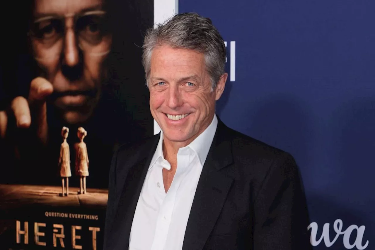 Hugh Grant recalls getting 'smashed' with Travis Kelce at a Taylor Swift concert