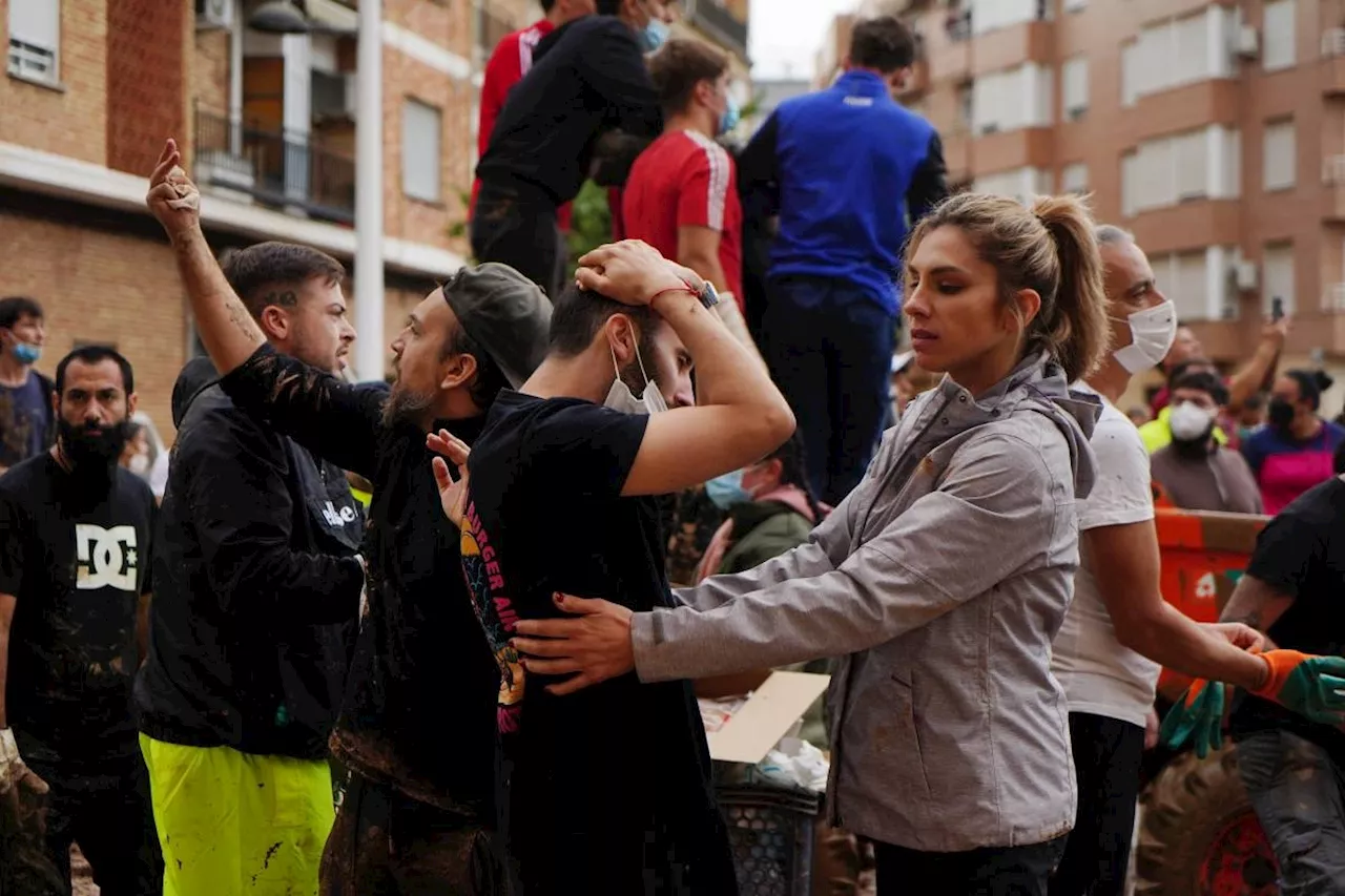 Crowds hurl mud at Spanish king on visit to flood disaster town