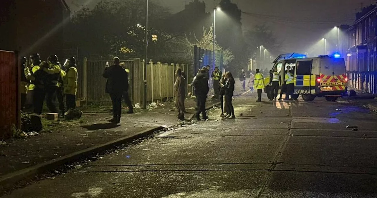 Mob of teenagers pelt police with fireworks in Manchester