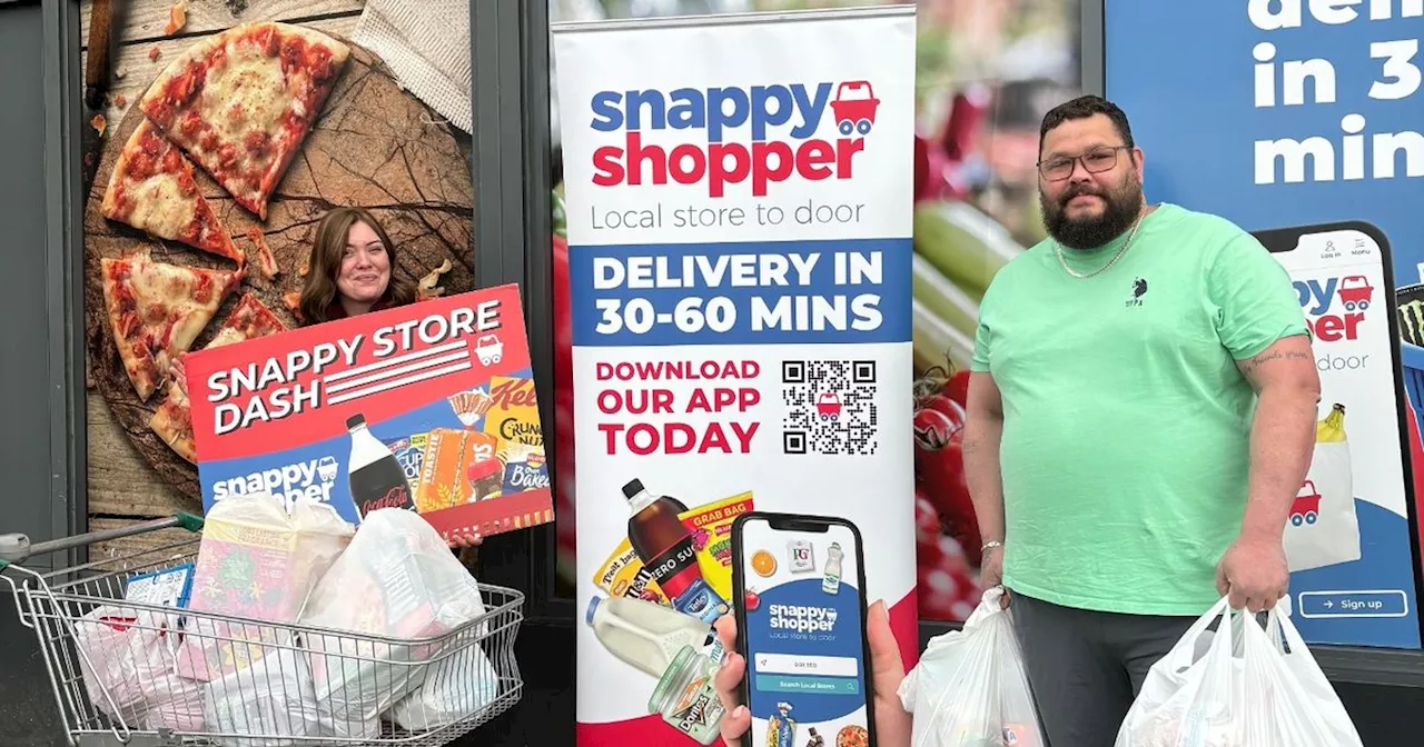 Two snap baskets of free groceries in dash round Cambuslang convenience store