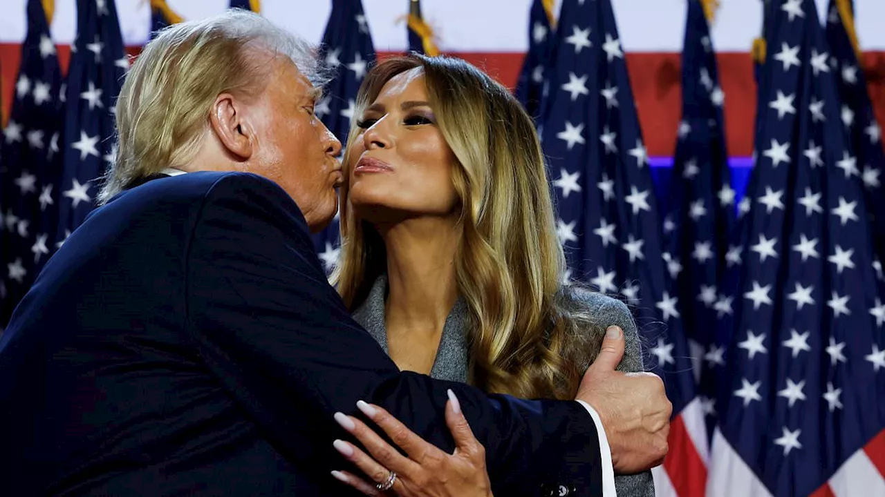 Standing by her man (again): Melania smiles and even gives Donald a kiss as he celebrates his...