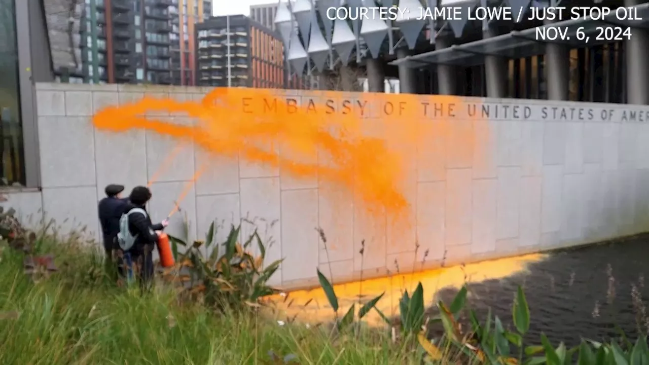 Climate activists spray US embassy in London with orange paint after Trump reelection victory