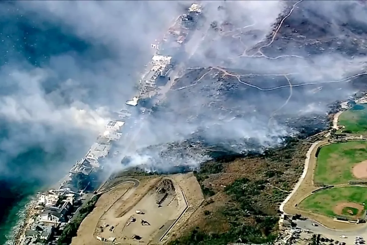 Hundreds flee homes as powerful winds feed wildfires in Southern California