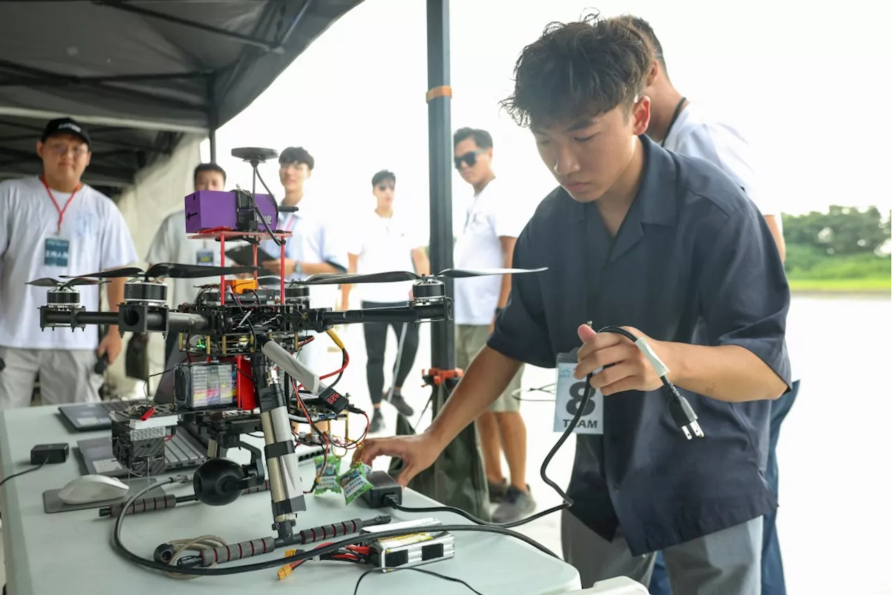 Taiwan students design drones for mock battle, as China threat looms