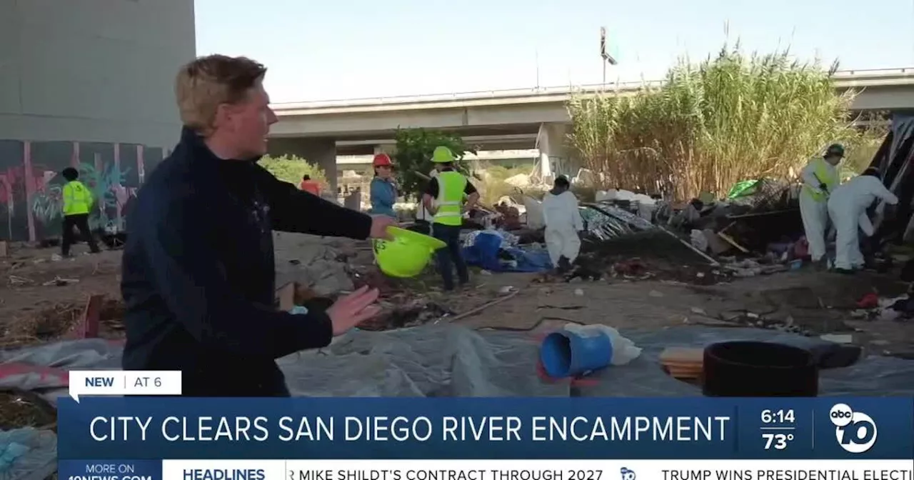 Crews in midst of clearing encampment along San Diego River