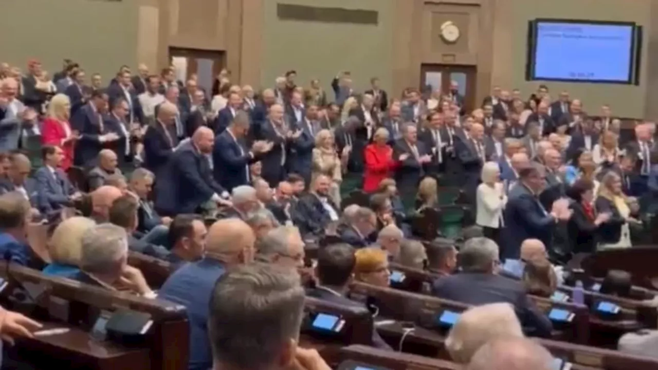 Astonishing moment Polish politicians chant 'Donald Trump, Donald Trump' in parliament as they...