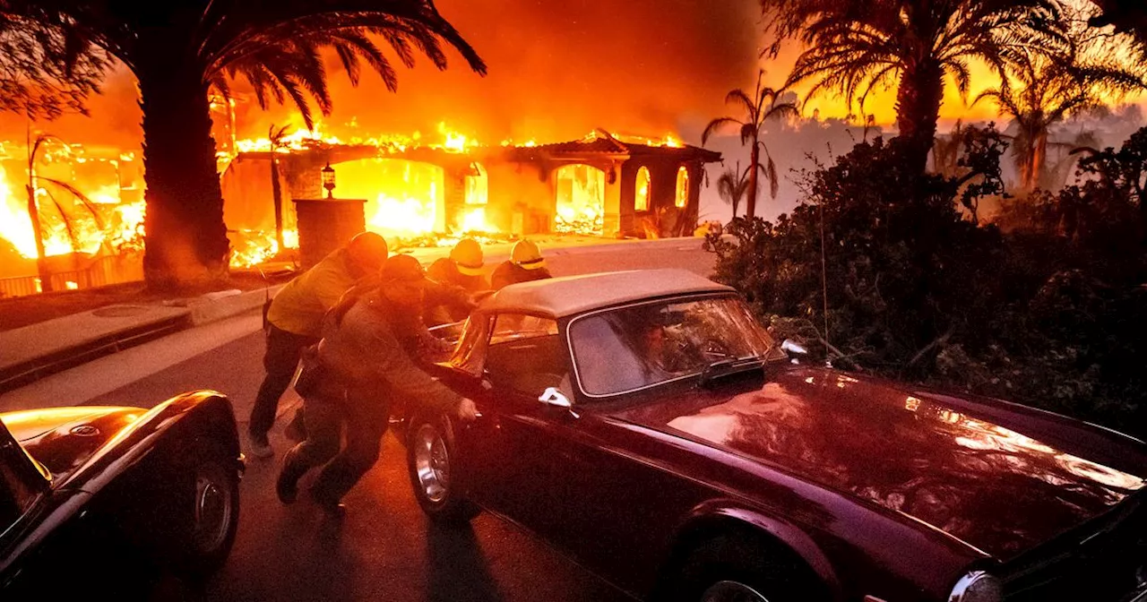 Thousands Ordered To Evacuate As Wind-Fed Wildfire Burns Homes In Southern California