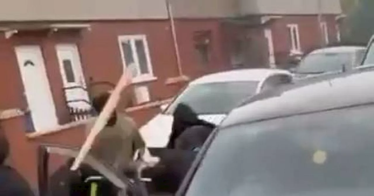 Horrifying video shows gang attacking man in his car in front of schoolchildren